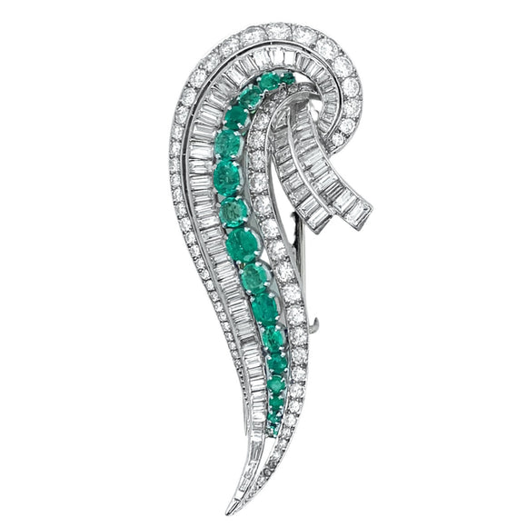 An Art Déco platinum, diamond and emerald brooch. 1935 circa