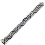 An Art Déco platinum diamond and sapphire bracelet. 1925