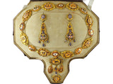 A XIX Century yellow gold en repoussé enameled parure. France, 1840 c.a.