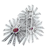 A platinum diamond and ruby flower brooch. 1940.