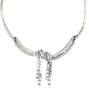 A platinum and diamond necklace, in the shape of a knot. 1950